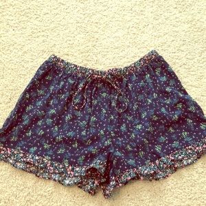 Navy floral shorts.